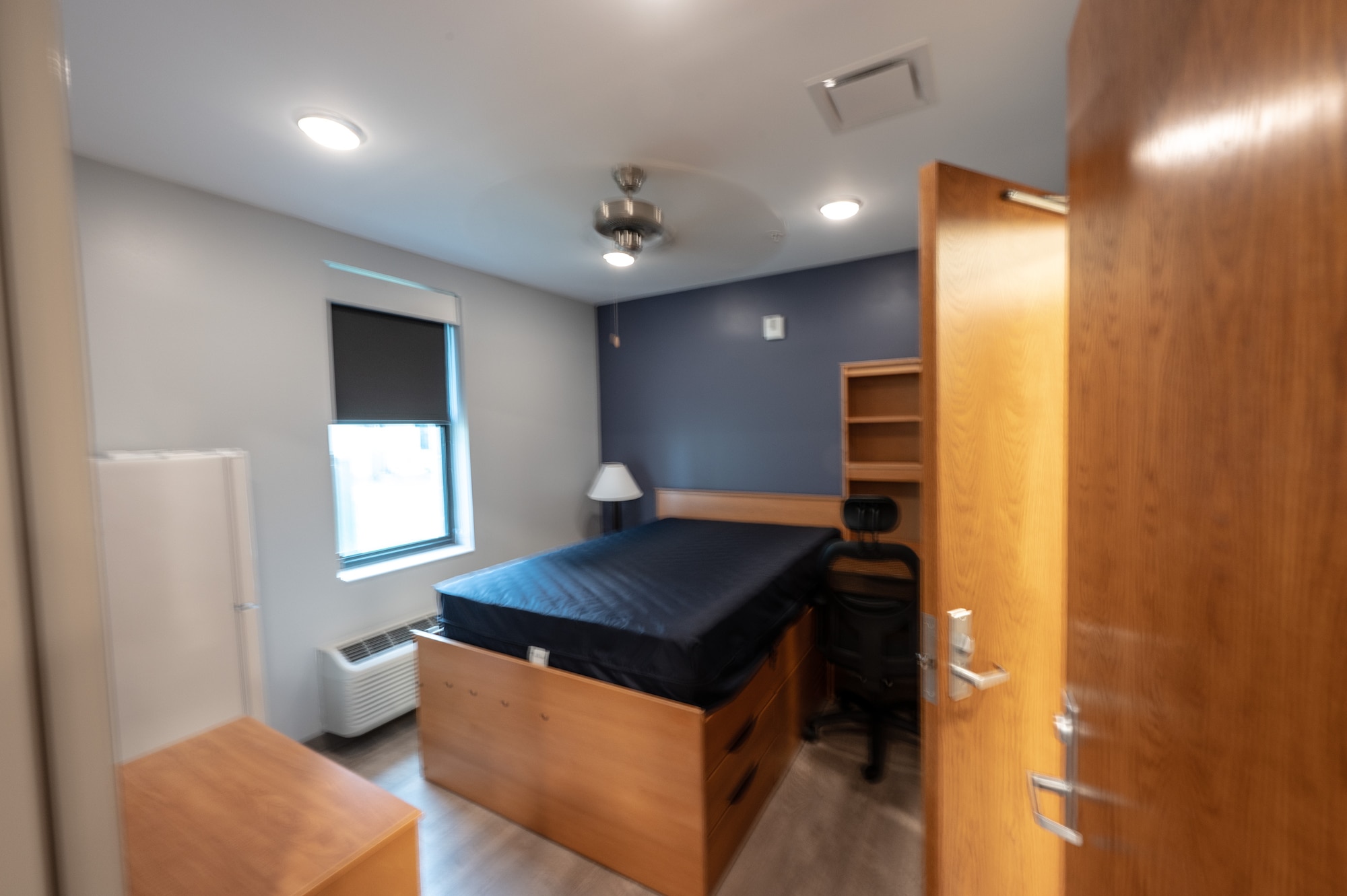 A newly finished view of the walk-in closet and bathroom of new dorm facility.