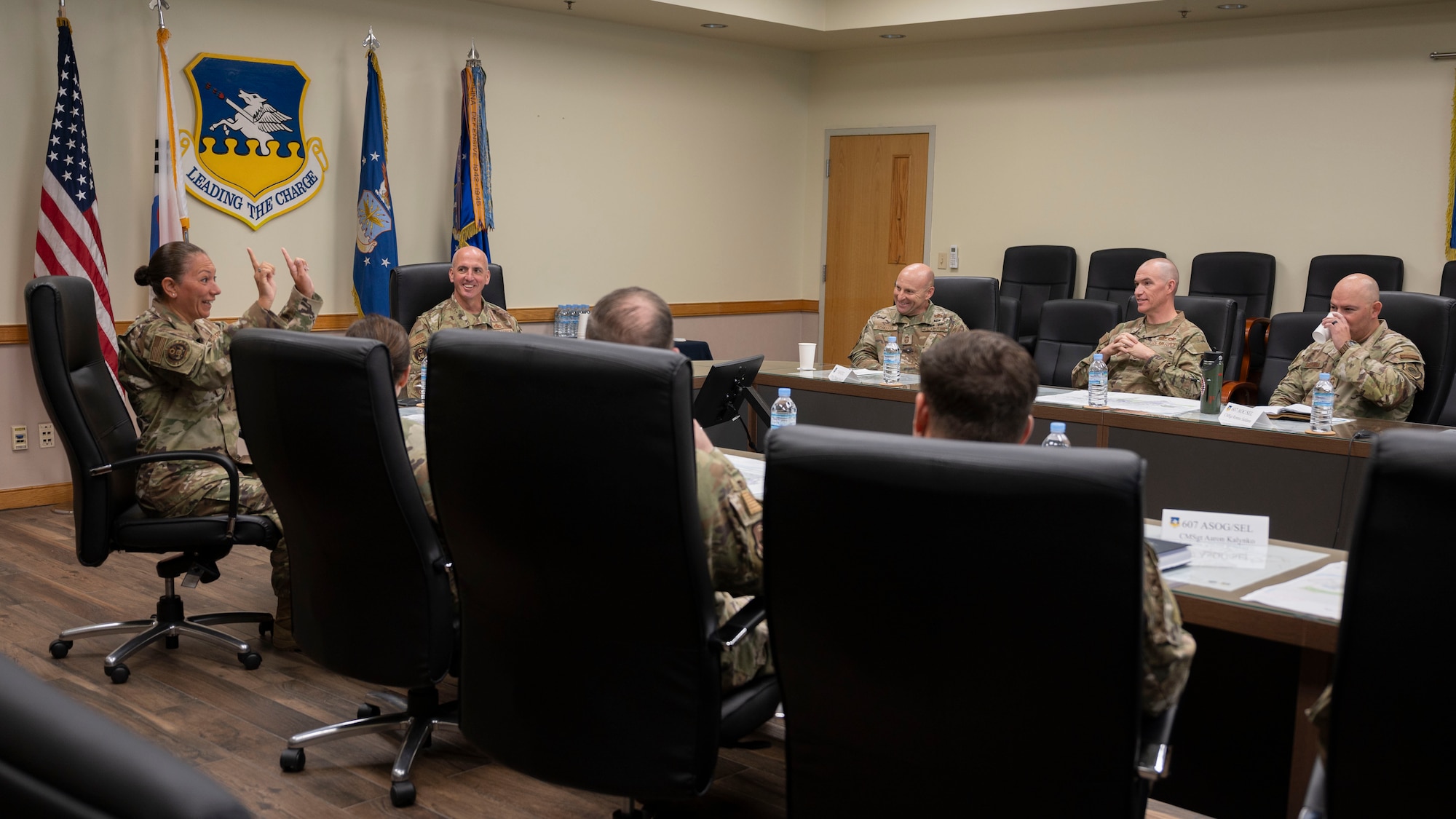 Chief Master Sgt. of the Air Force David Flosi, center left, laughs with enlisted leadership during a “Chief’s Round Table” at Osan Air Base, Republic of Korea, July 25, 2025. During the meeting, CMSAF Flosi met with command chiefs and senior enlisted leaders to discuss the 51st Fighter Wing mission, the future of the Air Force, and Osan’s critical role in regional security and Indo-Pacific stability. (U.S. Air Force photo by Senior Airman Rome Bowermaster)