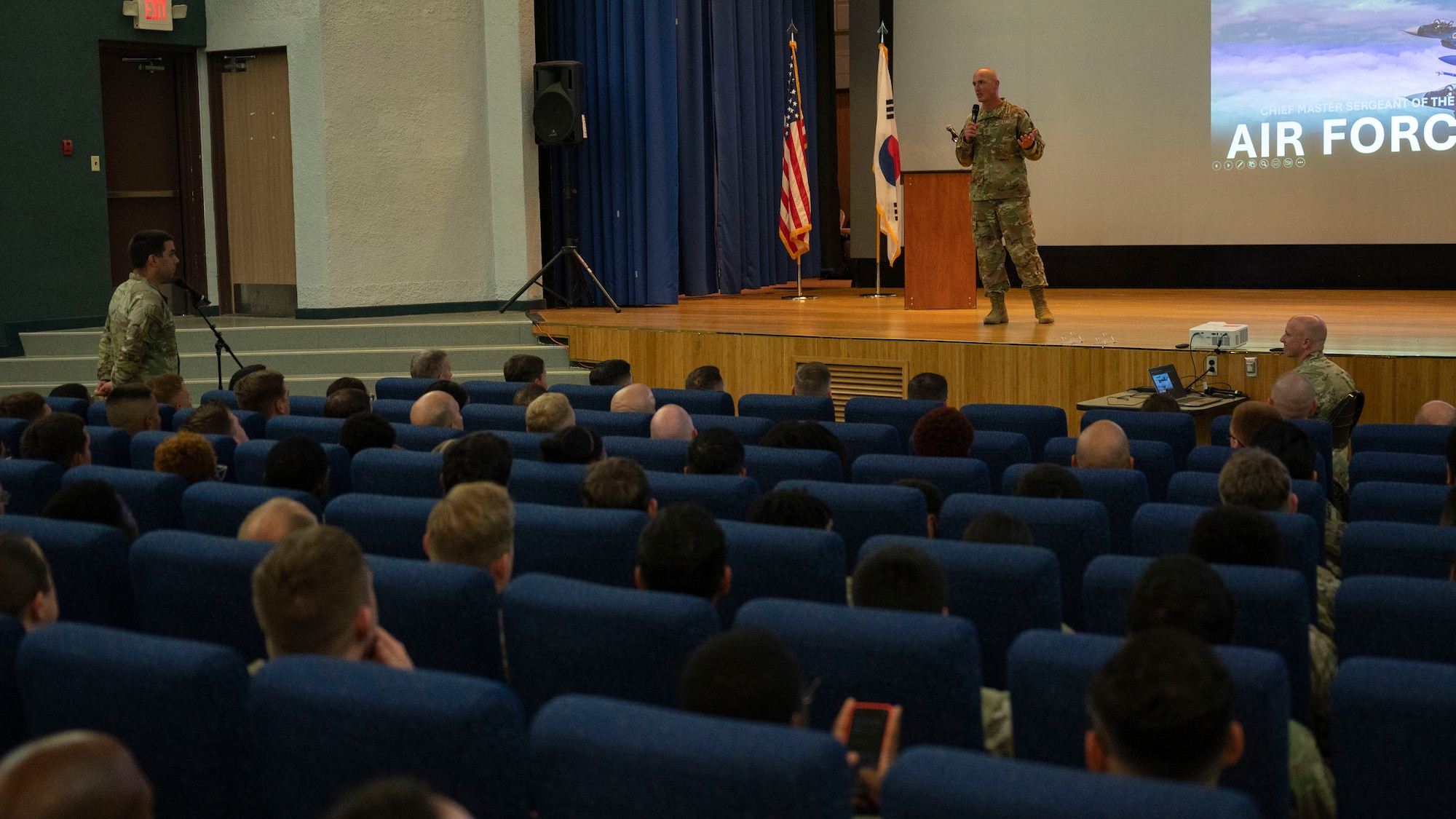 Chief Master Sgt. of the Air Force David Flosi answers a question at an all-call at Osan Air Base, Republic of Korea, July 25, 2025. The visit gave Flosi the opportunity to engage directly with Airmen at Osan, address their concerns and recognize their contributions to regional security. (U.S. Air Force photo by Senior Airman Rome Bowermaster)