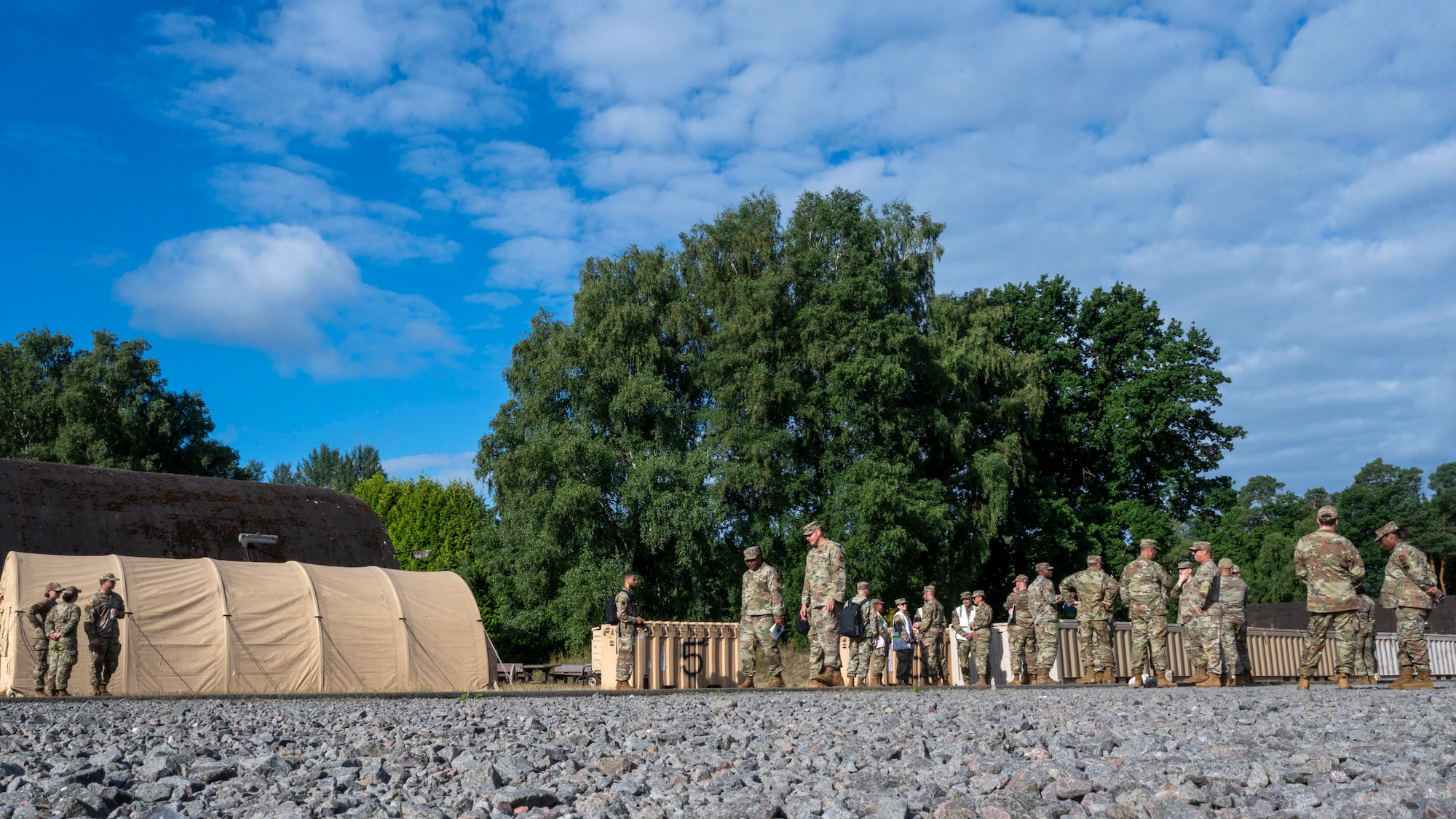 Chief Master Sergeant of the Air Force David A. Flosi tours the Silver Flag training site during his visit to Ramstein Air Base, Germany, July 23, 2025. Flosi engaged with Airmen advancing Department of Defense priorities through their execution of United States Air Forces in Europe – Air Forces Africa, 86th Airlift Wing and 435th Air Ground Operations Wing missions. The Silver Flag training site enables Airmen from civil engineer, force support and vehicle maintenance career fields to learn skills necessary to complete large-scale base recovery and rapid airfield damage recovery operations. (U.S. Air Force photo by Senior Airman Sabrina Fuller-Judd)