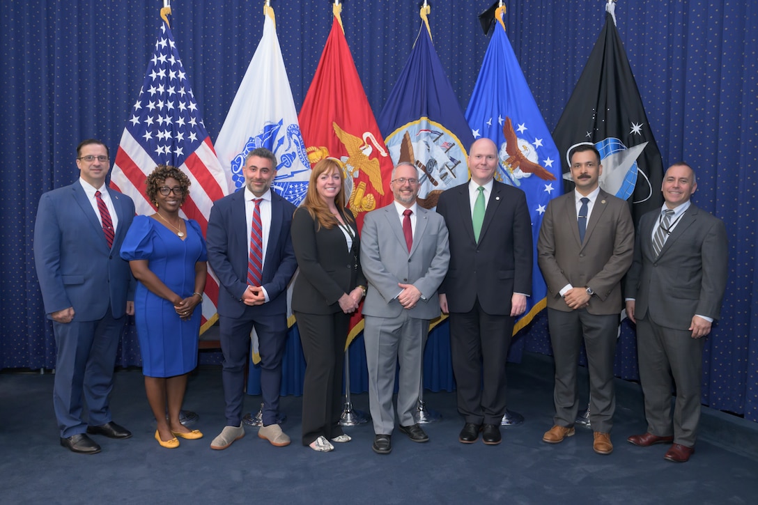 Deputy Assistant Secretary of State for Global Operations Seth Green, center, takes a photo with State Department and Defense Logistics Agency employees after his presentation during the DLA Campaign of Learning Warfighter Talk at Fort Belvoir, Virginia, July 17, 2025.