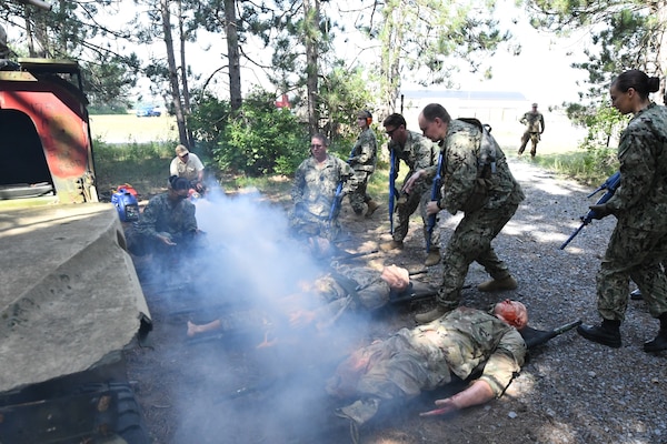 More than 50 Navy Reserve hospital corpsmen, doctors and nurses from across the country conducted their two-week annual training at Fort Drum’s Bridgewater-Vaccaro Medical Simulation Training Center (MSTC), July 14-25. The training highlighted the interoperability among forces, as Navy Reservists trained with Army, Coast Guard and New York Naval Militia in joint exercises. The culminating exercise required litter teams to move tactically through combat trauma lanes and perform an aeromedical evacuation with the 10th Combat Aviation Brigade DUSTOFF unit. The Sailors are assigned to Navy Reserve Navy Medicine Readiness and Training Command (NRNMRTC) Portsmouth, which provided medical training oversight during the Operation Commanding Force rotation. There were an additional 16 Sailors from Navy Medical Forces Atlantic Bethesda. Some arrived as far away as California and New Mexico, while others had a closer trip from upstate New York and Cleveland, Ohio. (Photo by Mike Strasser, Fort Drum Garrison Public Affairs)