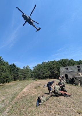 More than 50 Navy Reserve hospital corpsmen, doctors and nurses from across the country conducted their two-week annual training at Fort Drum’s Bridgewater-Vaccaro Medical Simulation Training Center (MSTC), July 14-25. The training highlighted the interoperability among forces, as Navy Reservists trained with Army, Coast Guard and New York Naval Militia in joint exercises. The culminating exercise required litter teams to move tactically through combat trauma lanes and perform an aeromedical evacuation with the 10th Combat Aviation Brigade DUSTOFF unit. The Sailors are assigned to Navy Reserve Navy Medicine Readiness and Training Command (NRNMRTC) Portsmouth, which provided medical training oversight during the Operation Commanding Force rotation. There were an additional 16 Sailors from Navy Medical Forces Atlantic Bethesda. Some arrived as far away as California and New Mexico, while others had a closer trip from upstate New York and Cleveland, Ohio. (Photo by Mike Strasser, Fort Drum Garrison Public Affairs)
