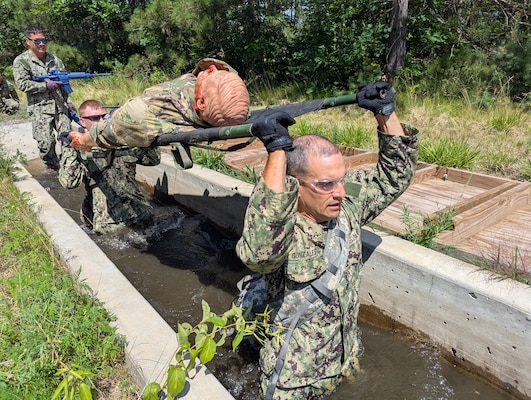 More than 50 Navy Reserve hospital corpsmen, doctors and nurses from across the country conducted their two-week annual training at Fort Drum’s Bridgewater-Vaccaro Medical Simulation Training Center (MSTC), July 14-25. The training highlighted the interoperability among forces, as Navy Reservists trained with Army, Coast Guard and New York Naval Militia in joint exercises. The culminating exercise required litter teams to move tactically through combat trauma lanes and perform an aeromedical evacuation with the 10th Combat Aviation Brigade DUSTOFF unit. The Sailors are assigned to Navy Reserve Navy Medicine Readiness and Training Command (NRNMRTC) Portsmouth, which provided medical training oversight during the Operation Commanding Force rotation. There were an additional 16 Sailors from Navy Medical Forces Atlantic Bethesda. Some arrived as far away as California and New Mexico, while others had a closer trip from upstate New York and Cleveland, Ohio. (Photo by Mike Strasser, Fort Drum Garrison Public Affairs)