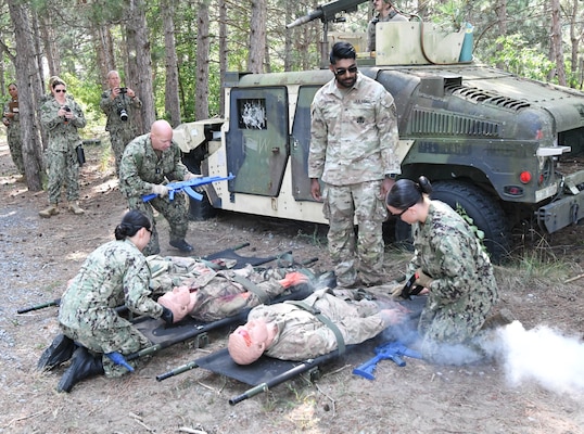 More than 50 Navy Reserve hospital corpsmen, doctors and nurses from across the country conducted their two-week annual training at Fort Drum’s Bridgewater-Vaccaro Medical Simulation Training Center (MSTC), July 14-25. The training highlighted the interoperability among forces, as Navy Reservists trained with Army, Coast Guard and New York Naval Militia in joint exercises. The culminating exercise required litter teams to move tactically through combat trauma lanes and perform an aeromedical evacuation with the 10th Combat Aviation Brigade DUSTOFF unit. The Sailors are assigned to Navy Reserve Navy Medicine Readiness and Training Command (NRNMRTC) Portsmouth, which provided medical training oversight during the Operation Commanding Force rotation. There were an additional 16 Sailors from Navy Medical Forces Atlantic Bethesda. Some arrived as far away as California and New Mexico, while others had a closer trip from upstate New York and Cleveland, Ohio. (Photo by Mike Strasser, Fort Drum Garrison Public Affairs)