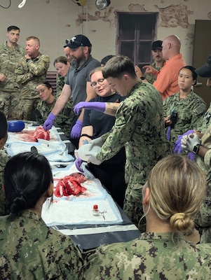 Navy Reserve medical personnel receive an anatomy/physiology class using a pig's lung inside the Bridgewater-Vaccaro Medical Simulation Training Center (MSTC) on July 17, as part of their two-week annual training rotation called Operation Commanding Force 2025 at Fort Drum. (Photo by Mike Strasser, Fort Drum Garrison Public Affairs)