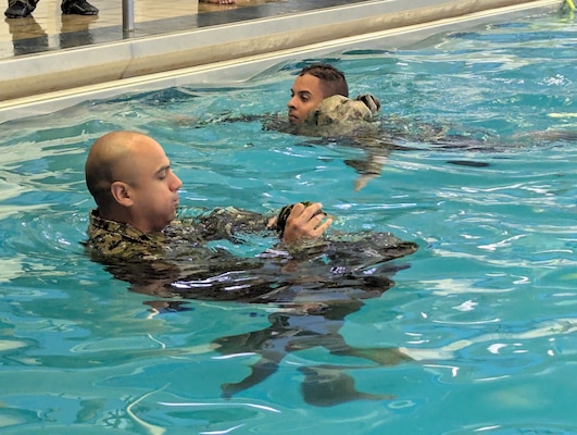 More than 50 Navy Reserve hospital corpsmen, doctors and nurses from across the country conducted their two-week annual training at Fort Drum’s Bridgewater-Vaccaro Medical Simulation Training Center (MSTC), July 14-25. The training highlighted the interoperability among forces, as Navy Reservists trained with Army, Coast Guard and New York Naval Militia in joint exercises. (Photo by Mike Strasser, Fort Drum Garrison Public Affairs)