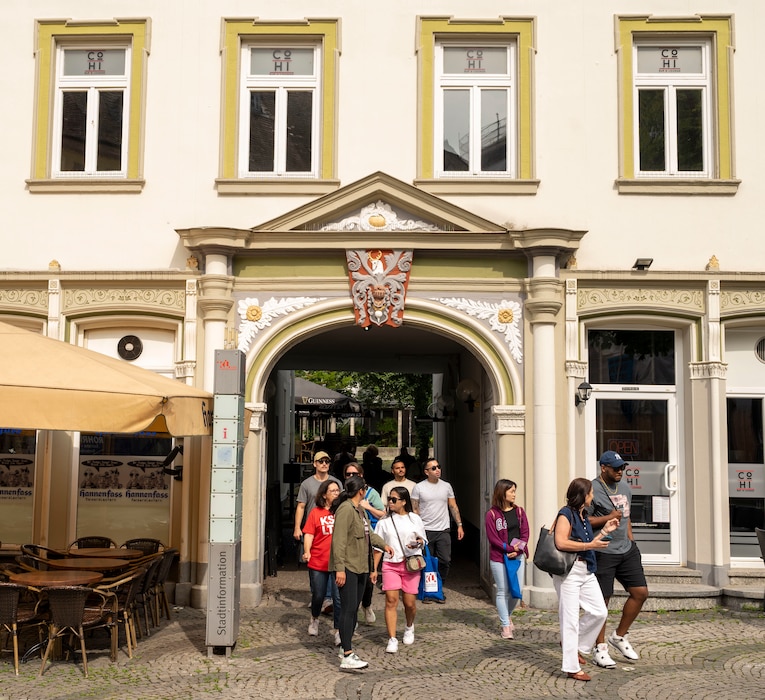 U.S. Air Force Airmen and families travel around Kaiserslautern during the Community Awareness & Regional Experience bus tour in Kaiserslautern, Germany, July 25, 2025. The CARE excursion introduced service members to everyday German customs, tipping culture, recycling and the Kaiserslautern Deutsche-Bahn public transportation system. (U.S. Air Force photo by Senior Airman Sabrina Fuller-Judd)