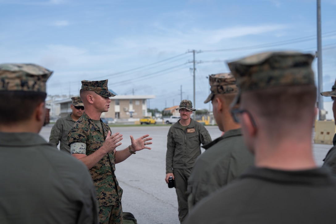 U.S. Marine Corps Master Sgt. Logan Swian, an operations chief with 2d Assault Amphibian Battalion, 2d Marine Division, II Marine Expeditionary Force, gives a convoy brief at Morehead City, North Carolina, July 17, 2025. Marines with 2nd Distribution Support Battalion, Combat Logistics Regiment 2, 2nd Marine Logistics Group and 2d AABN, alongside Marines and U.S. Navy Sailors with Whidbey Island-class dock landing ship USS Gunston Hall (LSD 44), Kearsarge Amphibious Ready Group, conducted embarkation and debarkation rehearsals aboard the USS Gunston Hall using the new amphibious combat vehicles. (U.S. Marine Corps photo by Lance Cpl. Javier Santillan)