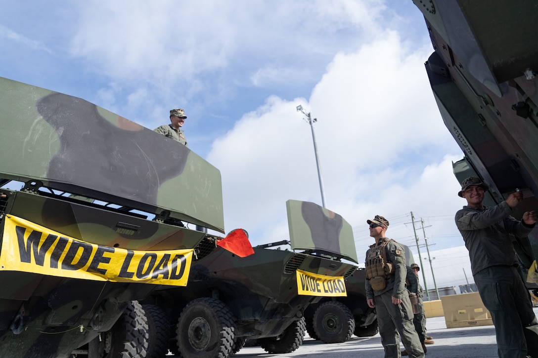 U.S. Marines with 2d Assault Amphibian Battalion, 2d Marine Division, II Marine Expeditionary Force, conduct prechecks before convoying from Morehead City to Camp Lejeune, North Carolina, July 17, 2025. Marines with 2nd Distribution Support Battalion, Combat Logistics Regiment 2, 2nd Marine Logistics Group and 2d AABN, alongside Marines and U.S. Navy Sailors with Whidbey Island-class dock landing ship USS Gunston Hall (LSD 44), Kearsarge Amphibious Ready Group, conducted embarkation and debarkation rehearsals aboard the USS Gunston Hall using the new amphibious combat vehicles. (U.S. Marine Corps photo by Lance Cpl. Javier Santillan)