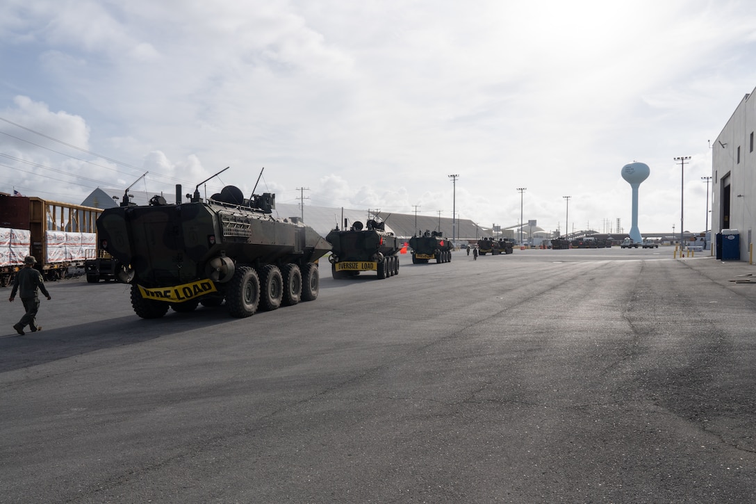 U.S. Marines with 2d Assault Amphibian Battalion, 2d Marine Division, II Marine Expeditionary Force, convoy from Morehead City to Camp Lejeune, North Carolina, following a well deck rehearsal July 17, 2025. Marines with 2nd Distribution Support Battalion, Combat Logistics Regiment 2, 2nd Marine Logistics Group and 2d AABN, alongside Marines and U.S. Navy Sailors with Whidbey Island-class dock landing ship USS Gunston Hall (LSD 44), Kearsarge Amphibious Ready Group, conducted embarkation and debarkation rehearsals aboard the USS Gunston Hall using the new amphibious combat vehicles. (U.S. Marine Corps photo by Lance Cpl. Javier Santillan)