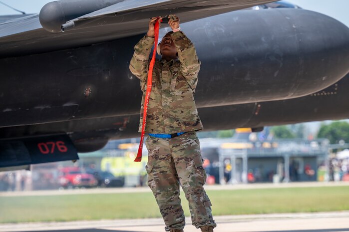 U.S. Air Force Staff Sgt. Brian Westmoreland, 9th Maintenance Squadron aircraft fuel systems repair technician, installs a pogo block onto a U-2 Dragon Lady wing prior to pogo installation at Oshkosh, Wisconsin, July 22, 2025.