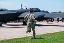 U.S. Air Force Staff Sgt. Trey Patterson, 9th Aircraft Maintenance Squadron U-2 crew chief, assists a U-2 Dragon Lady for shutdown after landing at Oshkosh, Wisconsin, July 20, 2025.