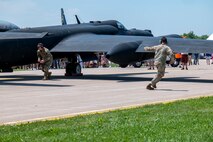 U.S. Air Force Airmen from the 9th Reconnaissance Wing assist a U-2 Dragon Lady for shutdown after landing at Oshkosh, Wisconsin, July 20, 2025.