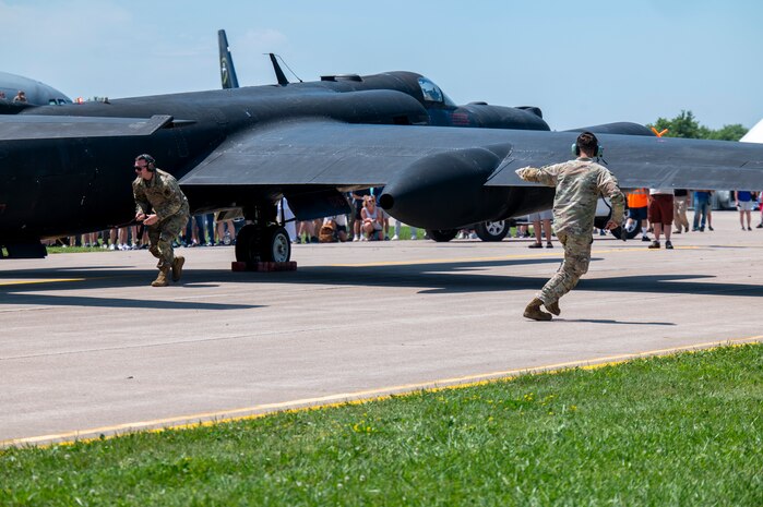 U.S. Air Force Airmen from the 9th Reconnaissance Wing assist a U-2 Dragon Lady for shutdown after landing at Oshkosh, Wisconsin, July 20, 2025.