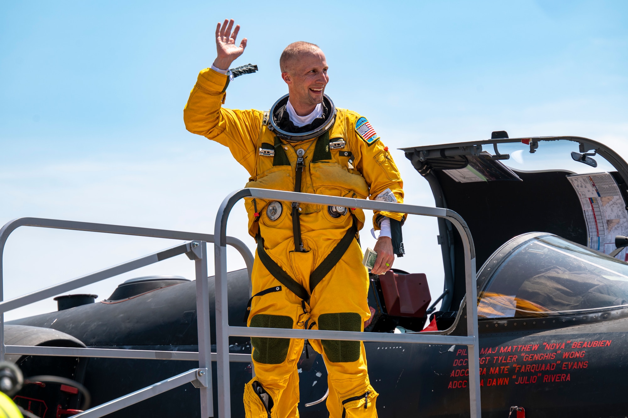 U.S. Air Force Lt. Col. GOGO, 9th Reconnaissance Wing inspector general, waves after exiting a U-2 Dragon Lady at Oshkosh, Wisconsin, July 20, 2025.