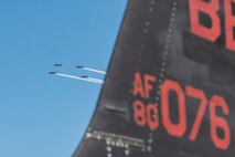 Aerial performers fly behind the tail flash of a U-2 Dragon Lady during Experimental Aircraft Association AirVenture Oshkosh 2025 at Oshkosh, Wisconsin, July 21, 2025