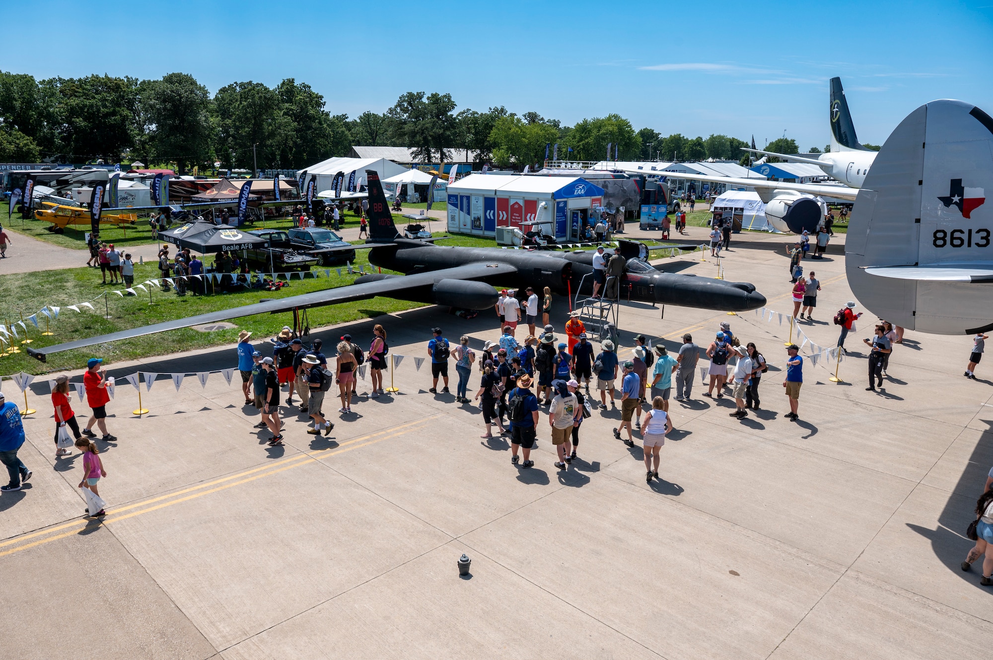 A 9th Reconnaissance Wing U-2 Dragon Lady is displayed at Experimental Aircraft Association AirVenture Oshkosh 2025, while U-2 pilots meet with airshow attendees in Oshkosh, Wisconsin, July 21, 2025.