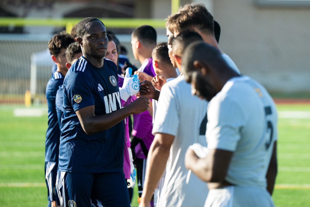 U.S. Army Soldiers and Navy Sailors shake hands before starting match three of the Armed Forces Men’s Soccer Championship in Phantom Warrior Stadium, Fort Hood, Texas, on July 28, 2025. Each team faces off in a bracket to determine which service will hold the championship title, featuring teams from the Army, Navy, and Air Force. (U.S. Army photo by Sgt. Tien Dat Ngo)