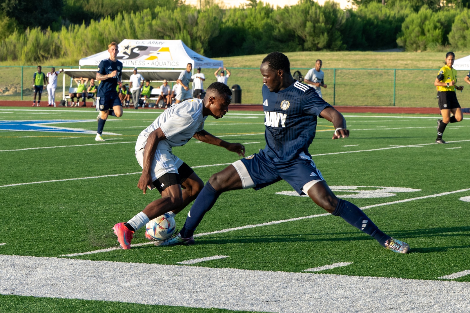 U.S. Navy Sailors and Army Soldiers fight for control of the ball during the Armed Forces Men’s Soccer Championship in Phantom Warrior Stadium, Fort Hood, Texas, on July 28, 2025. Each team faces off in a bracket to determine which service will hold the championship title, featuring teams from the Army, Navy, and Air Force. (U.S. Army photo by Sgt. Tien Dat Ngo)