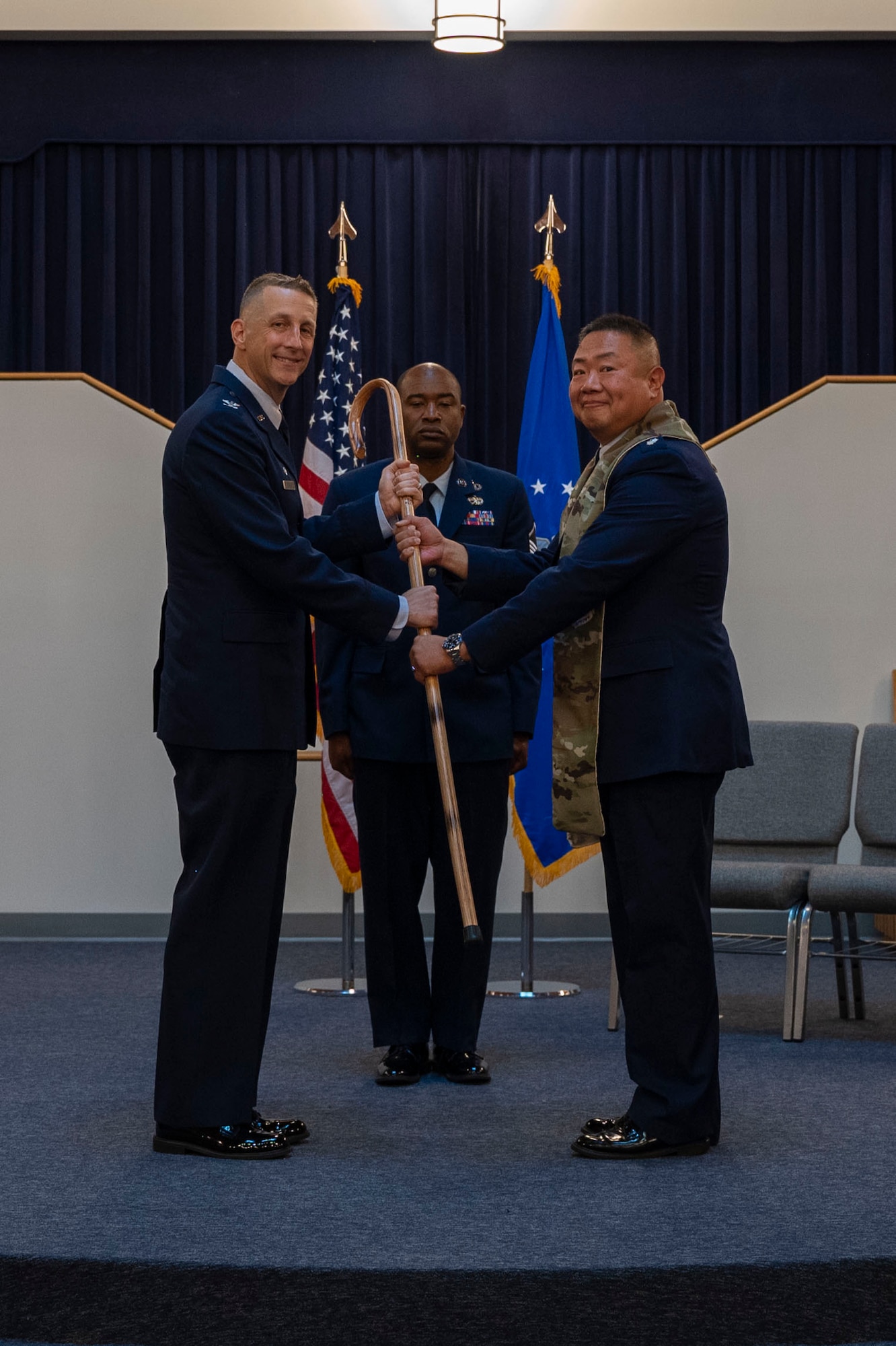 U.S. Air Force Col. Ryan A.F. Crowley, left, commander of Joint Base Anacostia-Bolling and the 11th Wing, gives the 11th WG Chaplain Corps stole to Lt. Col. Henry Hahm, incoming senior chaplain of the 11th WG, during a ceremony at JBAB, Washington, D.C., June 23, 2025.