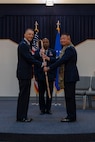 U.S. Air Force Col. Ryan A.F. Crowley, left, commander of Joint Base Anacostia-Bolling and the 11th Wing, gives the 11th WG Chaplain Corps stole to Lt. Col. Henry Hahm, incoming senior chaplain of the 11th WG, during a ceremony at JBAB, Washington, D.C., June 23, 2025.