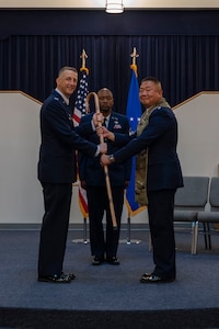 U.S. Air Force Col. Ryan A.F. Crowley, left, commander of Joint Base Anacostia-Bolling and the 11th Wing, gives the 11th WG Chaplain Corps stole to Lt. Col. Henry Hahm, incoming senior chaplain of the 11th WG, during a ceremony at JBAB, Washington, D.C., June 23, 2025.
