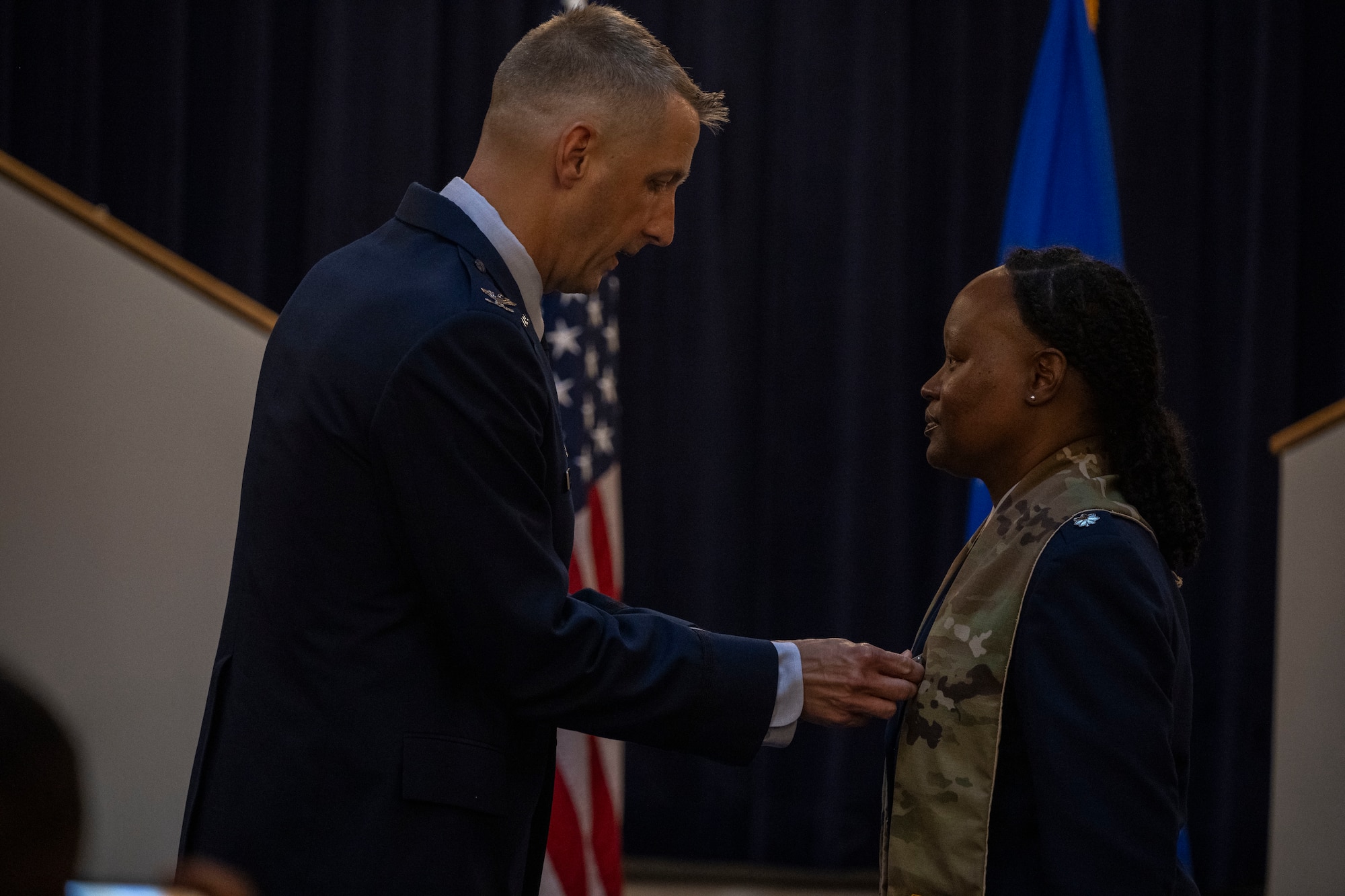 U.S. Air Force Col. Ryan A.F. Crowley, commander of Joint Base Anacostia-Bolling and the 11th Wing, left, pins the Meritorious Service Medal on Lt. Col. Meoshia Wilson, outgoing senior chaplain of the 11th WG Chaplain Corps, during a change of stole ceremony at JBAB, Washington, D.C., June 23, 2025.