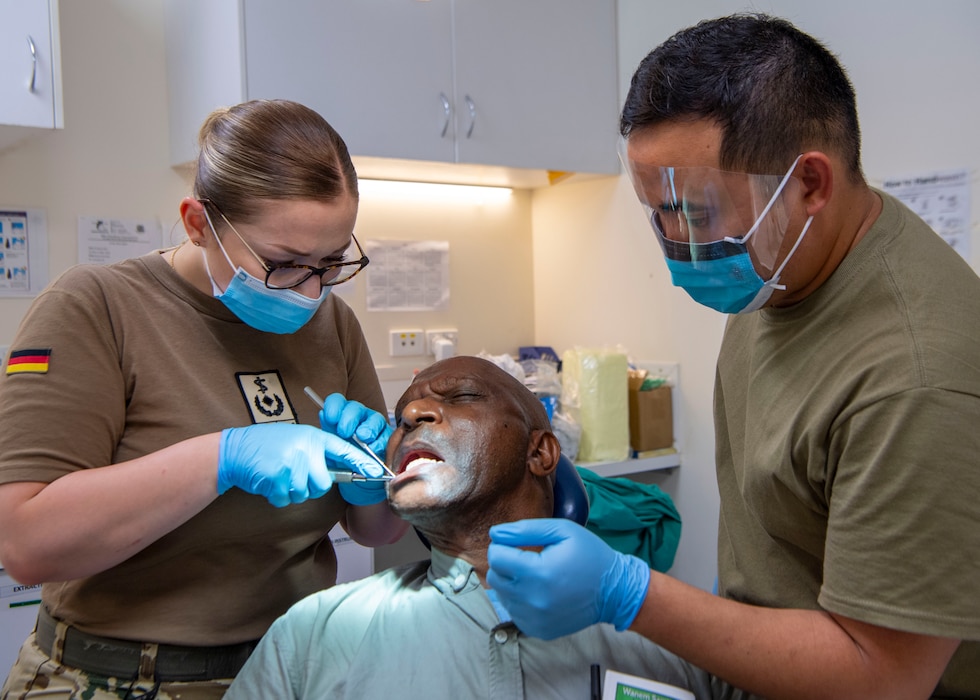 250728-N-OJ012-1064 LAE, Papua New Guinea (July 28, 2025) – German Armed Forces Maj. Anne Marie Bettenhausen, left, and U.S. Navy Hospital Corpsman 1st Class John Pascual provide dental care at the Andau Dental Clinic, in Lae, Papua New Guinea, July 28, 2025. Now in its 21st iteration, the Pacific Partnership series is the largest annual multinational humanitarian assistance and disaster management preparedness mission conducted in the Indo-Pacific. Pacific Partnership works collaboratively with host and partner nations to enhance regional interoperability and disaster response capabilities, increase security and stability in the region, and foster new and enduring friendships in the Indo-Pacific. (U.S. Navy photo by Mass Communication Specialist Seaman Mario E. Reyes Villatoro)