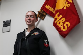 U.S. Navy Hospital Corpsman Emma Ratzlaff with Headquarters & Service Company poses for a photo at Marine Barracks Washington on July 21, 2025. Ratzlaff supports the battalion surgeon and independent duty corpsman by treating acute and routine medical issues and providing field coverage during infantry training. She manages medical readiness for Bravo Company and the U.S. Marine Corps Drum and Bugle Corps, ensuring Marines are fully mission capable each week. Her professionalism and commitment directly support the health, performance, and operational success of Marines at the barracks. (U.S. Marine Corps photo by Brynn Bouchard)