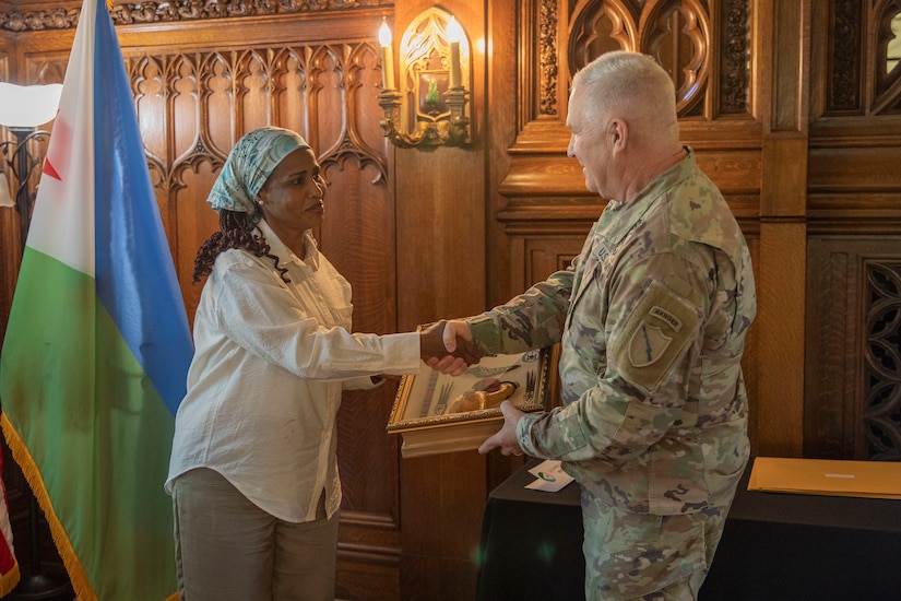 Colonel Amina Mohamed Moussa of the Djiboutian Armed Forces presents a gift to Maj. Gen. Haldane Lamberton, adjutant general of Kentucky, during a key leader engagement in Frankfort, Kentucky, July 23, 2025.