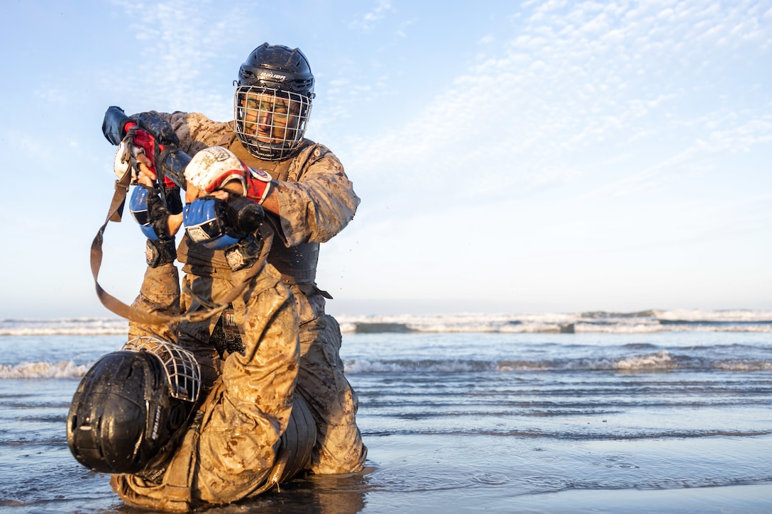 U.S. Marines with 1st Reconnaissance Battalion, 1st Marine Division, grapple during the Martial Arts Instructor Course 99-25 culminating event at Marine Corps Base Camp Pendleton, California, July 9, 2025.