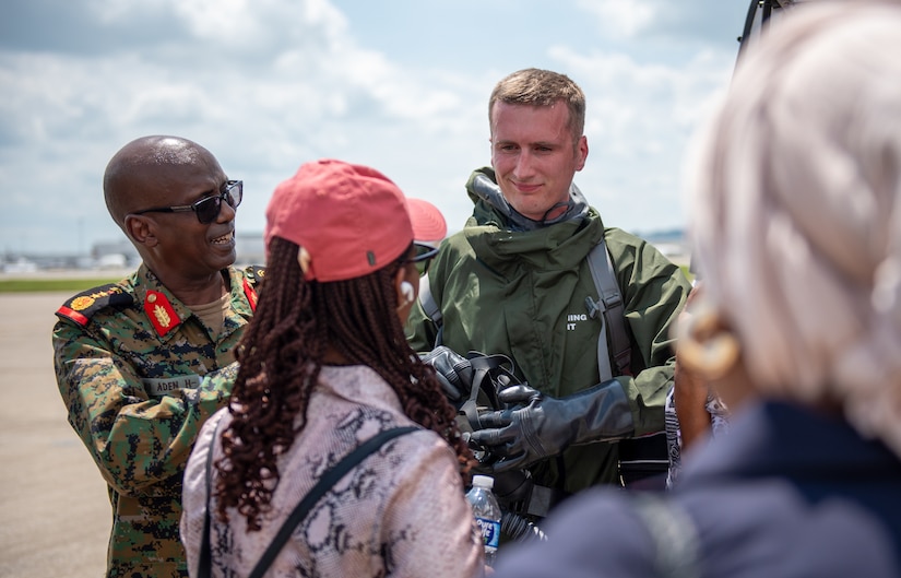 U.S. Air Force Tech. Sgt. Jacob Brockman, a medic with the Kentucky Air National Guard’s 123rd Medical Group, Detachment 1, discusses the capabilities of a hazardous materials protective suit with leadership from the Djiboutian armed forces during their visit to the Kentucky Air National Guard Base in Louisville, Ky., July 22, 2025.