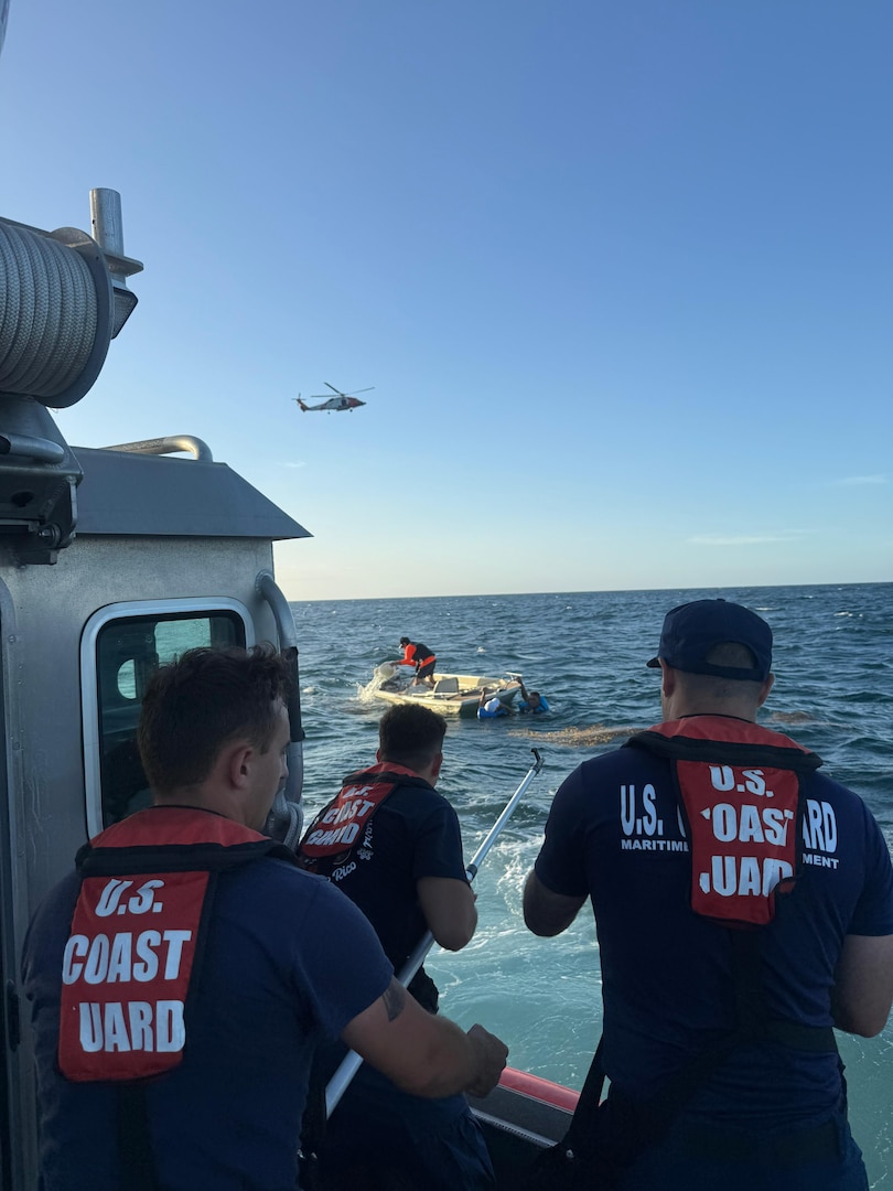 Coast Guard Station San Juan boat crew rescues three boaters from the water after they were forced to abandon their vessel that was taking on a water, approximately one nautical mile north of San Juan Harbor, July 28, 2025.  The Coast Guard boat crew worked with a Puerto Rico Police Marine unit to bring the boaters and the distressed vessel to safe harbor. (U.S. Coast Guard photo)