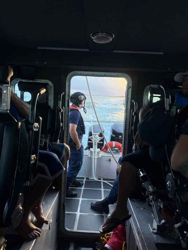 Coast Guard Station San Juan boat crew rescues three boaters from the water after they were forced to abandon their vessel that was taking on a water, approximately one nautical mile north of San Juan Harbor, July 28, 2025.  The Coast Guard boat crew worked with a Puerto Rico Police Marine unit to bring the boaters and the distressed vessel to safe harbor. (U.S. Coast Guard photo)