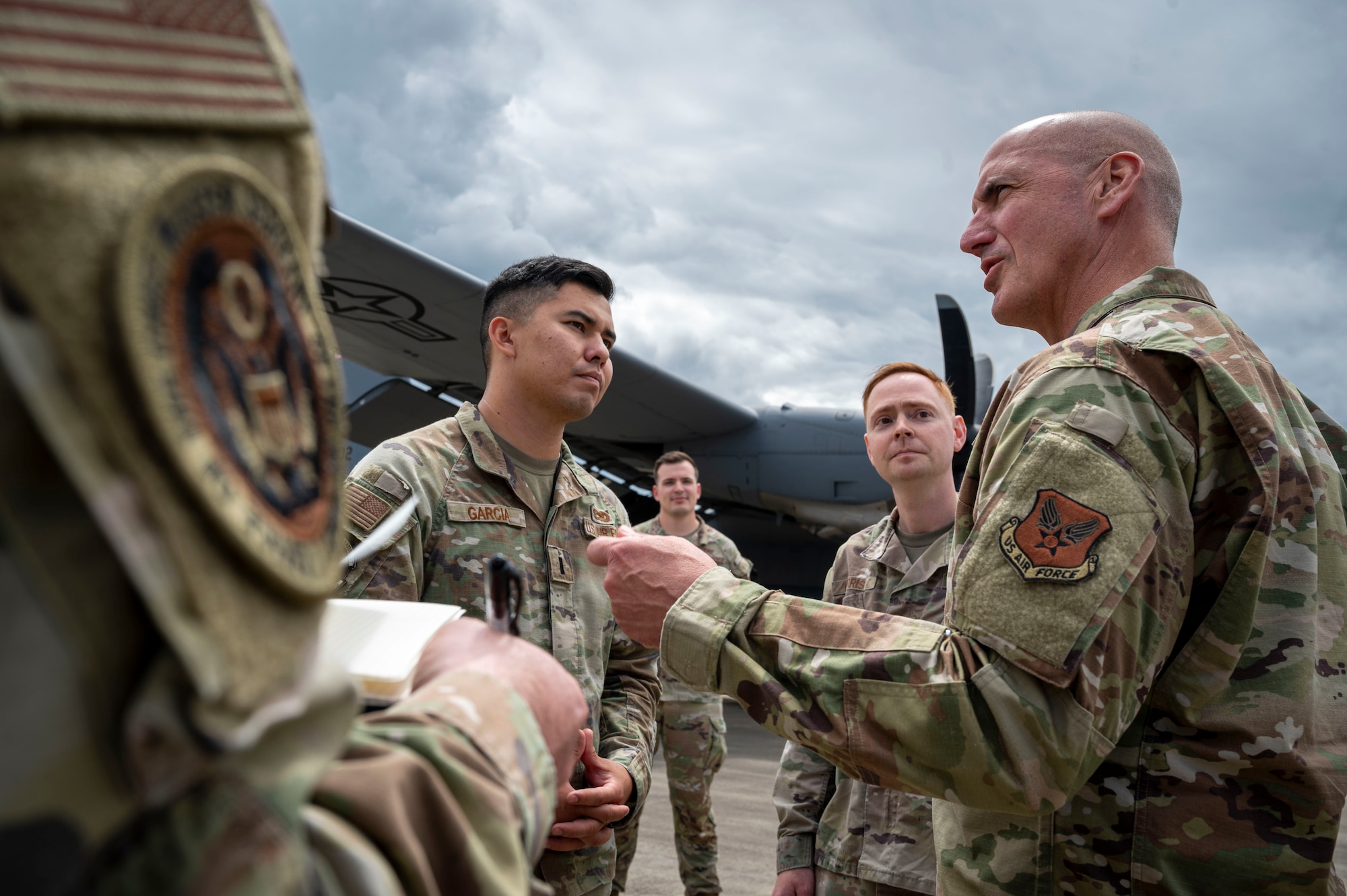 Chief Master Sergeant of the Air Force David A. Flosi speaks with 1st Lt. Ryan Garcia, 86th Maintenance Squadron maintenance flight commander, speaks about Agile Warrior during his visit to Ramstein Air Base, Germany, July 23, 2025. Flosi engaged with Airmen advancing Department of Defense priorities through their execution of U.S. Air Forces in Europe – Air Forces Africa, 86th Airlift Wing and 435th Air Ground Operations Wing missions. (U.S. Air Force photo by Senior Airman Sabrina Fuller-Judd)