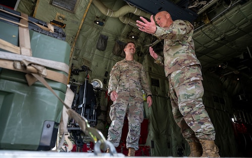 Chief Master Sergeant of the Air Force David A. Flosi speaks with Staff Sgt. Hunter Rhonden, 86th Operations Support Squadron air traffic controller, during his visit to Ramstein Air Base, Germany, July 23, 2025. Flosi learned about how Airmen from across Ramstein enhance their readiness and warrior ethos through programs like Agile Warrior. (U.S. Air Force photo by Senior Airman Sabrina Fuller-Judd)
