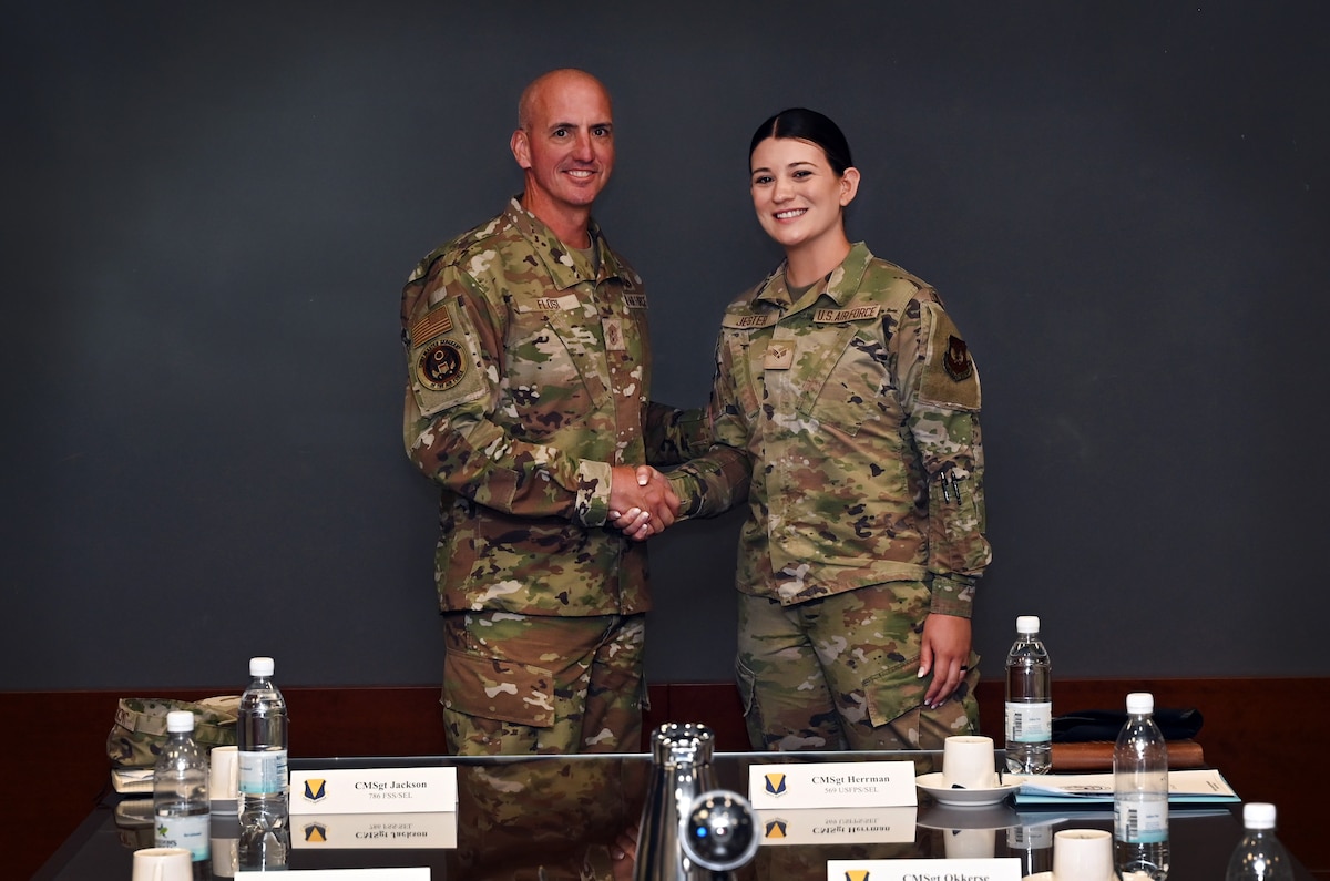 Chief Master Sergeant of the Air Force David A. Flosi recognizes the mission performance of Senior Airman Whitney Jester, 86th Security Forces Squadron patrolman, during his visit to Ramstein Air Base, Germany, July 23, 2025. Flosi recognized outstanding Airmen from across the installation and lauded their commitment to advancing Department of Defense and Air Force priorities. (U.S. Air Force photo by Senior Airman Sabrina Fuller-Judd)