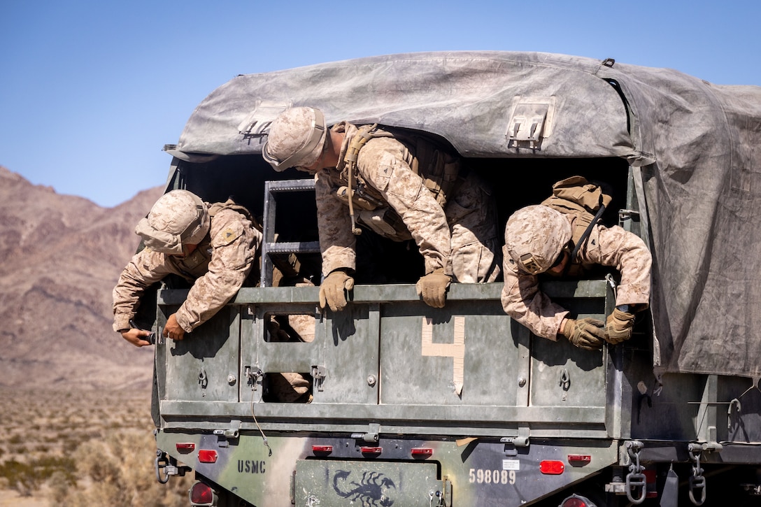 U.S. Marines with the 4th Law Enforcement Battalion, Force Headquarters Group secure a truck bed on a medium tactical vehicle replacement during Integrated Training Exercise 3-25 (ITX 3-25) at Marine Corps Air Ground Combat Center, Twentynine Palms, California, June 10th, 2025. ITX is a critical Marine Air-Ground Task Force exercise for the Marine Forces Reserve’s training cycle, confirming unit readiness through live-fire and combined arms integration. (U.S. Marine Corps photo by Lance Cpl. Edward Spears)