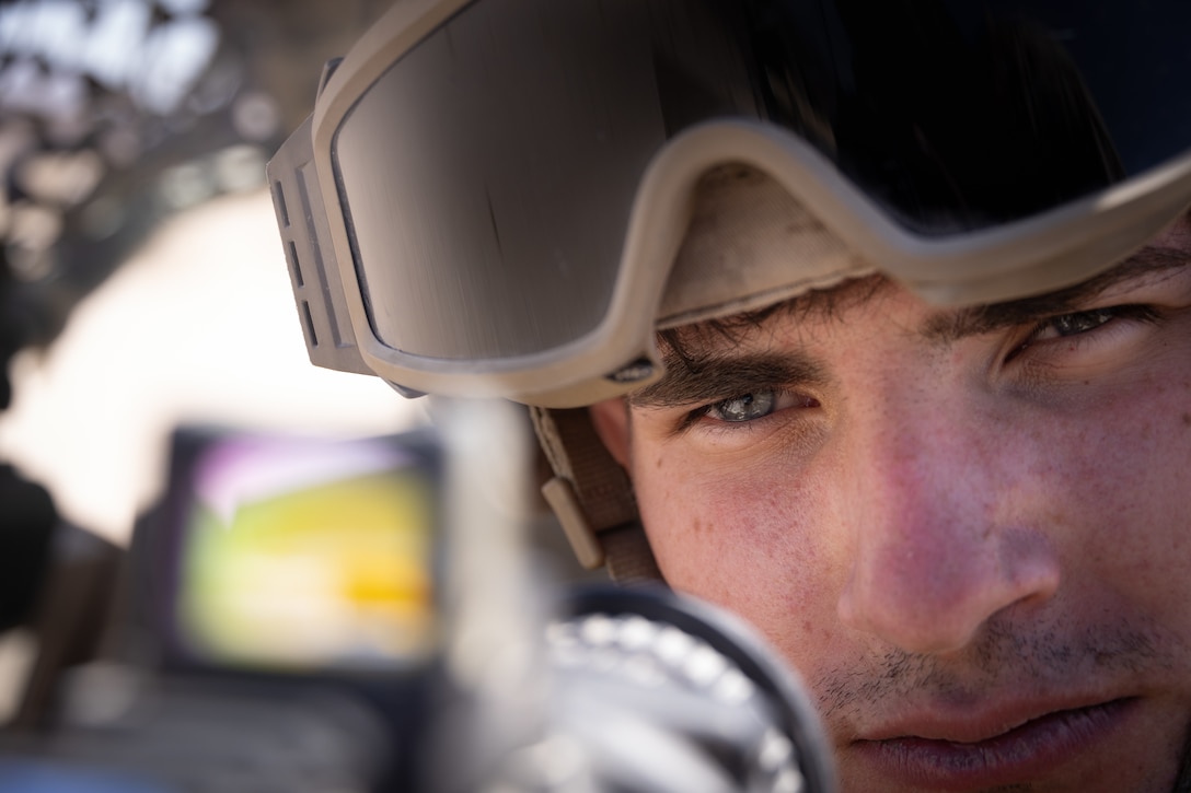 U.S. Marine Corps Cpl. Braedyn Nadzam, a military police officer with 4th Law Enforcement Battalion, Force Headquarters Group, sights into an M240 machine gun at Integrated Training Exercise 3-25 (ITX 3-25) at Marine Corps Air Ground Combat Center, Twentynine Palms, California, June 10th, 2025. ITX is a critical Marine Air-Ground Task Force exercise for the Marine Forces Reserve’s training cycle, confirming unit readiness through live-fire and combined arms integration. (U.S. Marine Corps photo by Lance Cpl. Edward Spears)