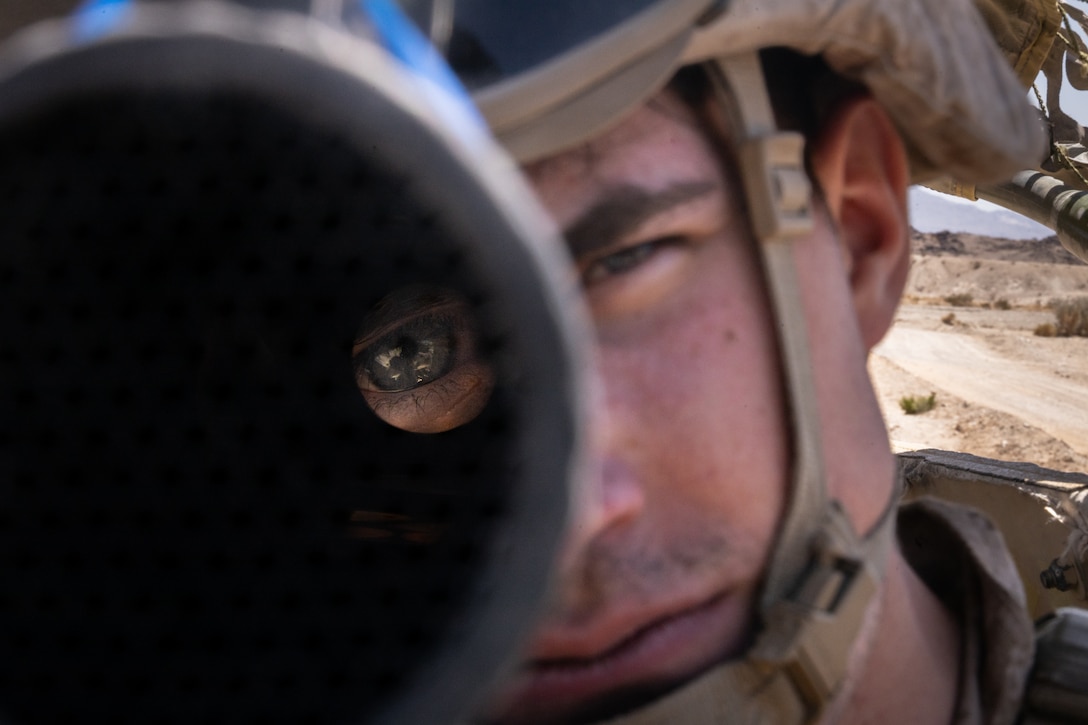 U.S. Marine Corps Cpl. Braedyn Nadzam, a military police officer with 4th Law Enforcement Battalion, Force Headquarters Group, sights into an M240 machine gun at Integrated Training Exercise 3-25 (ITX 3-25) at Marine Corps Air Ground Combat Center, Twentynine Palms, California, June 10th, 2025. ITX is a critical Marine Air-Ground Task Force exercise for the Marine Forces Reserve’s training cycle, confirming unit readiness through live-fire and combined arms integration. (U.S. Marine Corps photo by Lance Cpl. Edward Spears)
