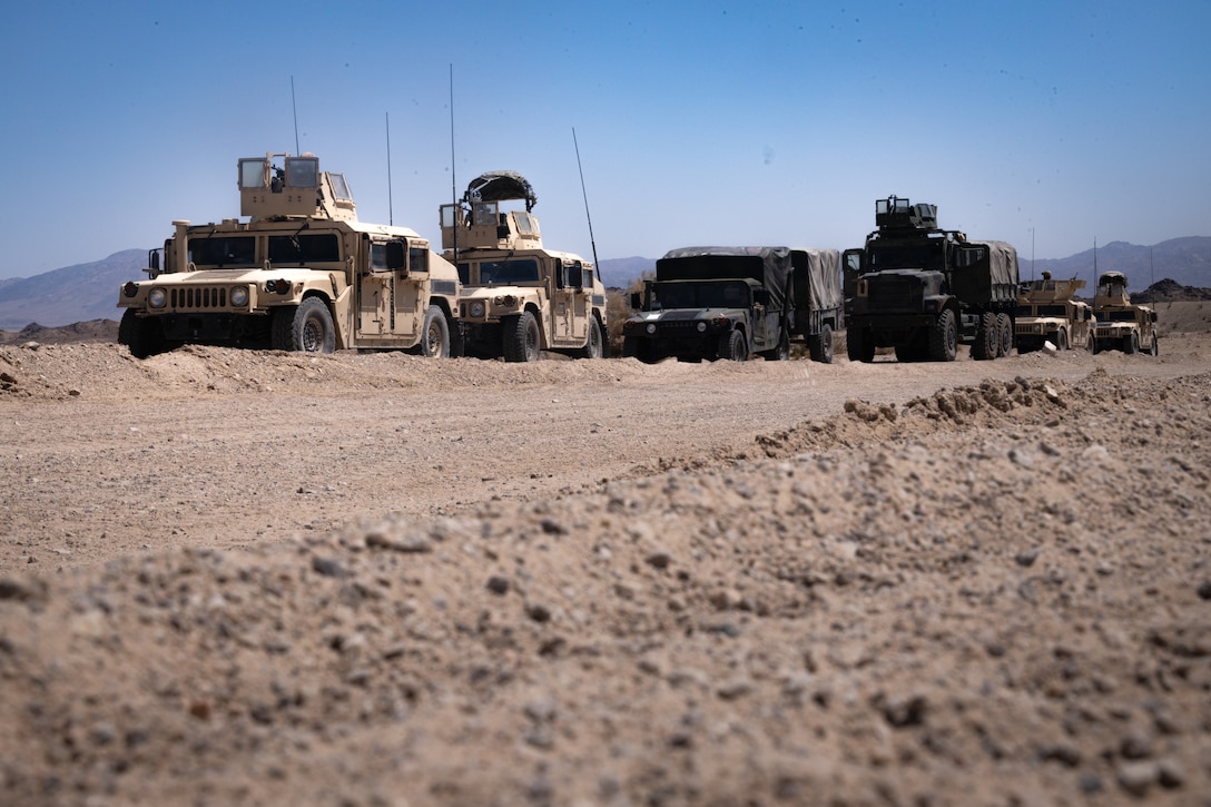 U.S. Marines with the 4th Law Enforcement Battalion, Force Headquarters Group form a convoy in a Motorized Operations Course during Integrated Training Exercise 3-25 (ITX 3-25) at Marine Corps Air Ground Combat Center, Twentynine Palms, California, June 10th, 2025. ITX is a critical Marine Air-Ground Task Force exercise for the Marine Forces Reserve’s training cycle, confirming unit readiness through live-fire and combined arms integration. (U.S. Marine Corps photo by Lance Cpl. Edward Spears)