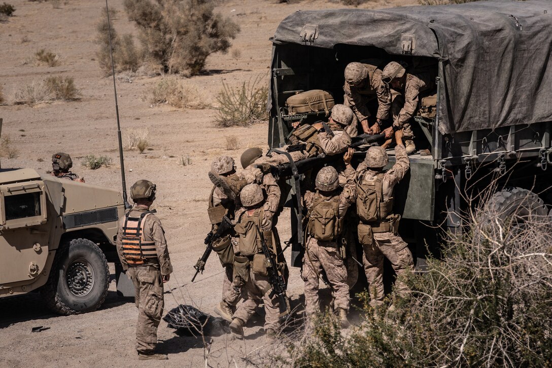 U.S. Marines with the 4th Law Enforcement Battalion, Force Headquarters Group perform a simulated casualty evacuation during Integrated Training Exercise 3-25 (ITX 3-25) at Marine Corps Air Ground Combat Center, Twentynine Palms, California, June 10th, 2025. ITX is a critical Marine Air-Ground Task Force exercise for the Marine Forces Reserve’s training cycle, confirming unit readiness through live-fire and combined arms integration. (U.S. Marine Corps photo by Lance Cpl. Edward Spears)