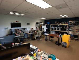 U.S. Airmen from the 509th Maintenance Group and cadets from various college ROTC programs work together during an internship program at Whiteman Air Force Base, Missouri, July 17, 2025. The internship allowed cadets to experience a military work environment while also granting the chance to gain knowledge outside the classroom. (U.S. Air Force photo by Senior Airman Joseph Garcia)