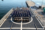 The crew of the Coast Guard Cutter Tahoma standing at parade rest on the flight deck at Port Everglades, Florida, July 29, 2025. The seized contraband was the result of an interdiction on June 24, 2025, approximately 120 miles northwest of Ecuador. (U.S. Coast Guard photo by Petty Officer 3rd Class Nicholas Strasburg)