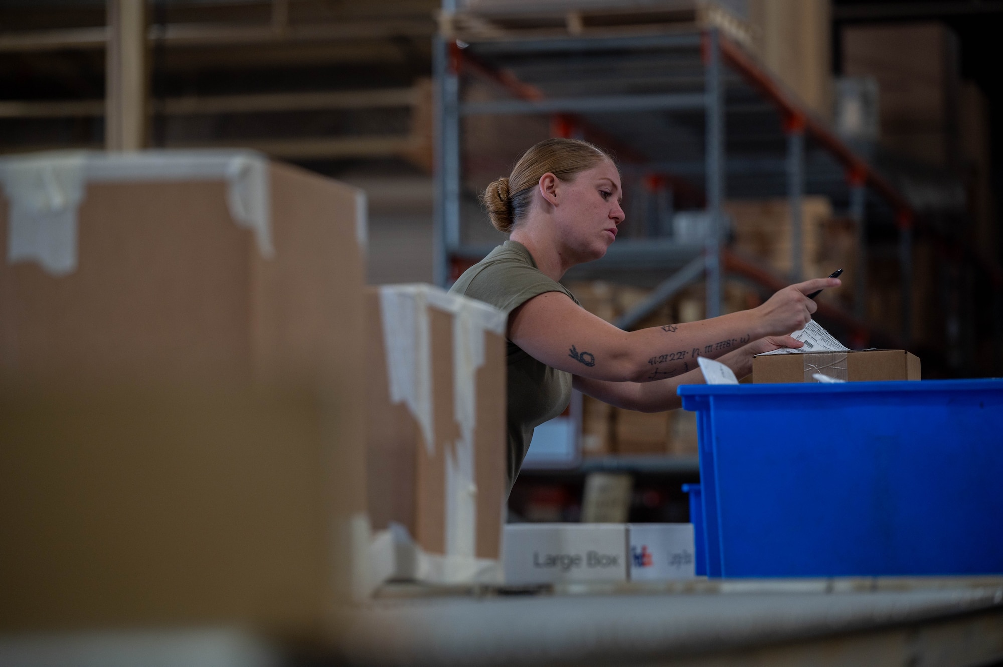 Senior Airman Alexia Rickard, 419th Logistics Readiness Squadron traffic management office journeyman, double checks documents for a shipment during her annual tour at Nellis Air Force Base, Nev., July 28, 2025.