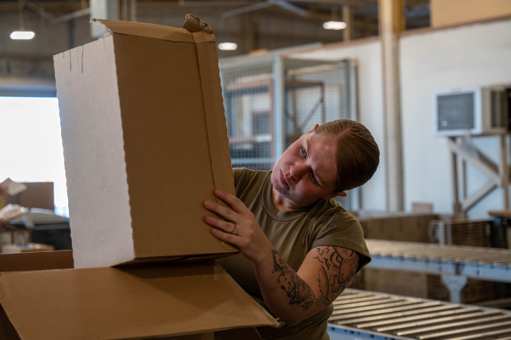 Senior Airman Alexia Rickard, 419th Logistics Readiness Squadron traffic management office journeyman, checks a part number to ensure that the correct part was shipped during her annual tour at Nellis Air Force Base, Nev., July 28, 2025.