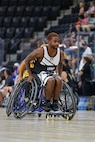 U.S. Army Staff Sgt. Allaijah Churchwell moves down the court during a wheelchair basketball game at the 2025 Department of Defense Warrior Games at Colorado Springs, Colorado, July 20, 2025.