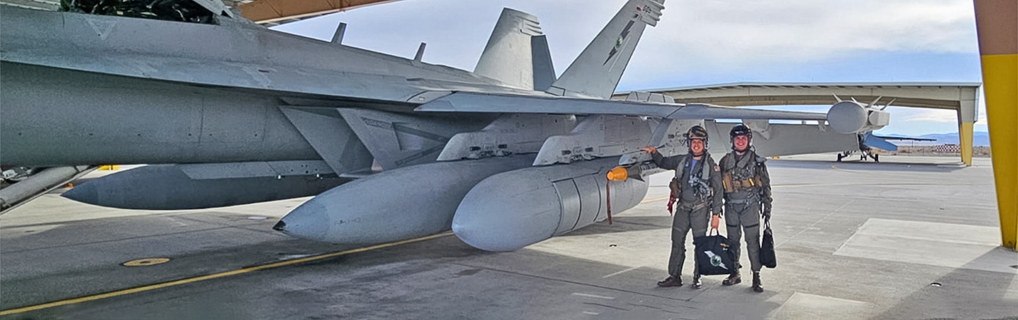 U.S. Navy Lt. Matt Haney prepares to fly the EA-18G Growler at Naval Aviation Warfighting Development Center (NAWDC). Haney is an instructor at the Airborne Electronic Attack Weapons School enrolled in the new Masters of Warfare Operations (MWO) degree program at the Naval Postgraduate School. He is in the first MWO cohort of TOPGUN students and instructors that began in Jan. 2025, with courses in strategic competition, combat systems analysis and statistics, naval tactics and technologies, and space systems fundamentals.