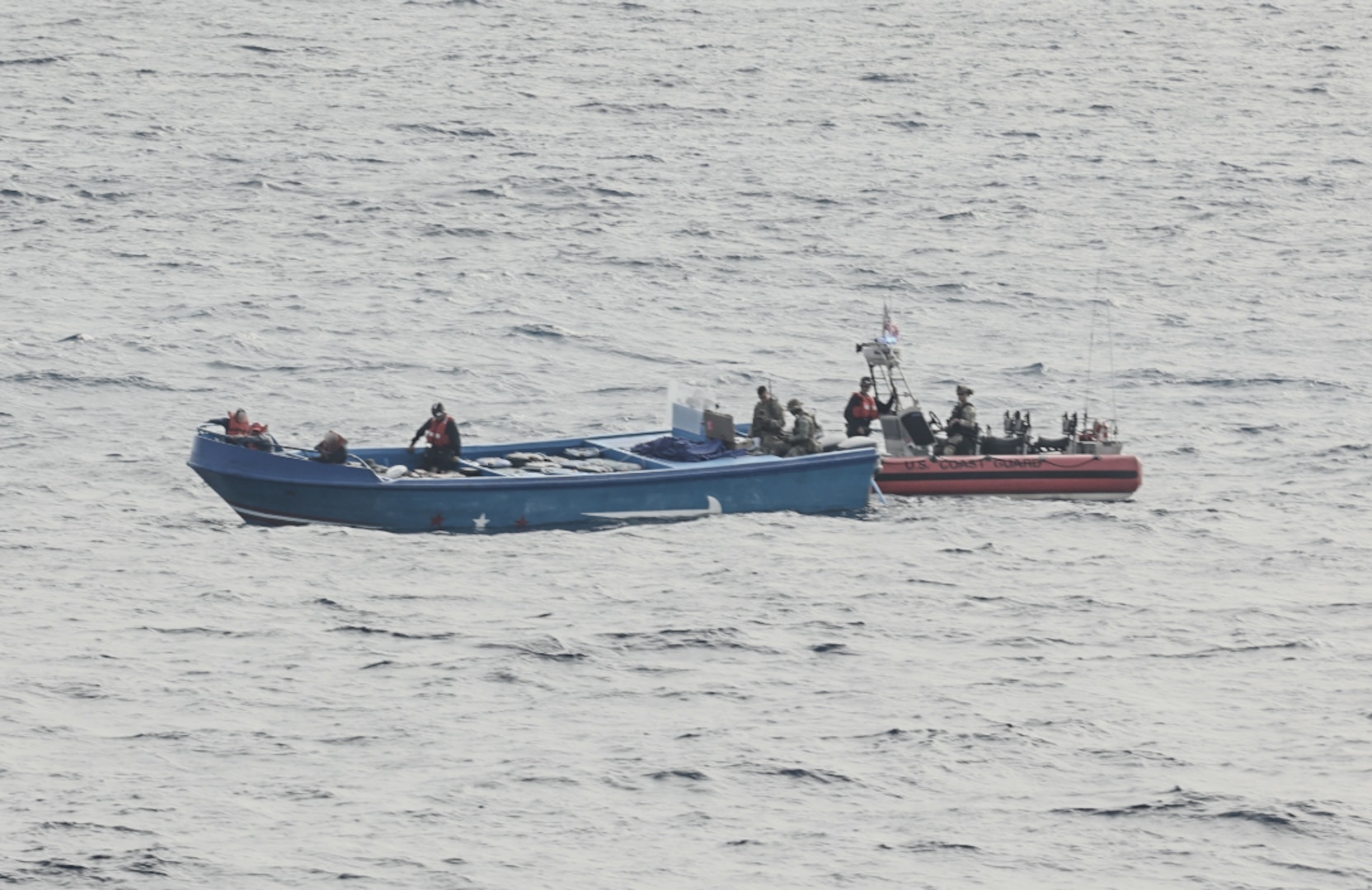 A Coast Guard small boat crew boarding a vessel suspected of drug smuggling operations approximately 120 miles northwest of Ecuador. U.S. Coast Guard Cutter Tahoma’s crew offloaded approximately 9,970 pounds of cocaine worth $73.7 million, Tuesday, at Port Everglades. (Courtesy asset)